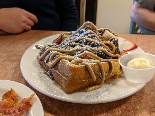 "Fancy" french toast. Definitely carb loaded nut tasted amazing - Nutella, peanut butter, strawberries and blueberries