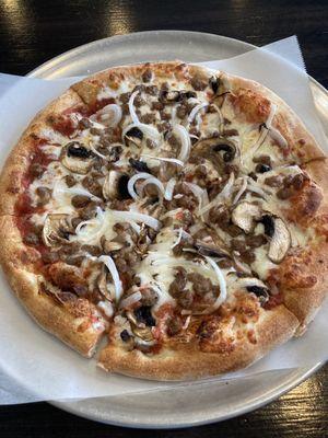 10" 3 topping pie of beef, mushrooms and onions. With tax about $15.