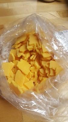 Supposed to be slices of sharp cheddar cheese,  apparently I got the crumbles. I threw it away.