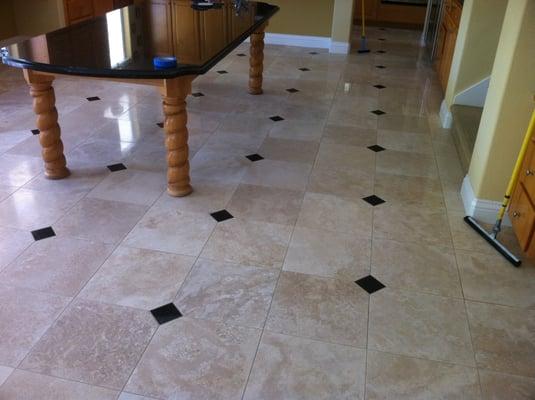 Cleaned and polished travertine tile.  Clean grout lines!