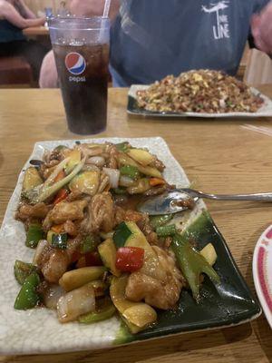 Szechuan chicken. Pork fried rice in background.