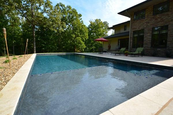 Rectangular pool with tanning ledge and built-in steps