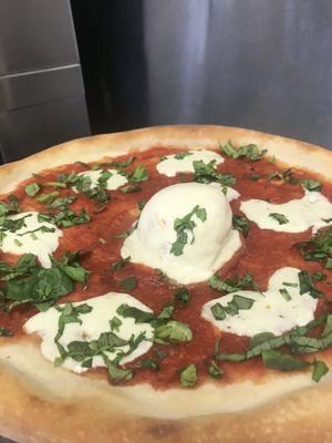 Burratta cheese pizza with fresh basil