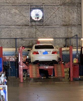 My car on the wheel alignment rack.