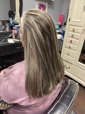 Blending colors to help client grow her naturally changing hair.