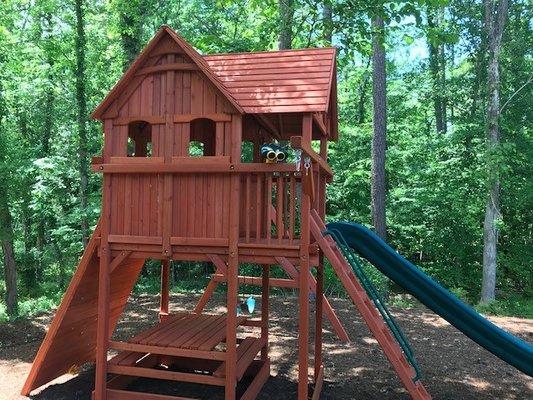 Another Playhouse XL with full picnic table and upper enclosure.