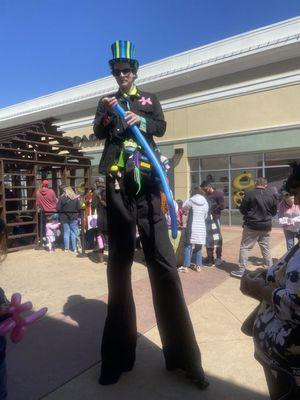 Stilt walking balloon artist