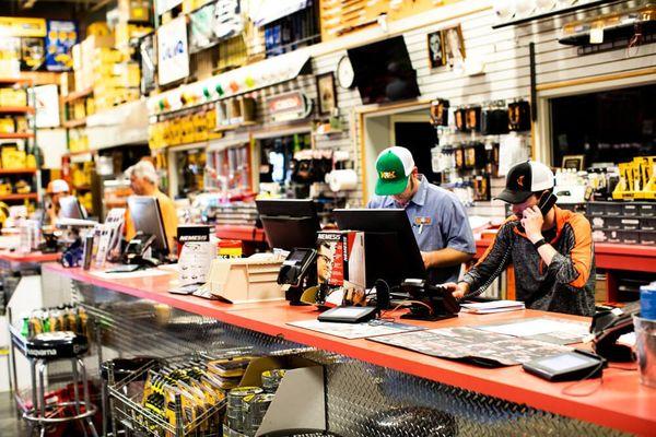 busy workers working the front counter of K&K Supply