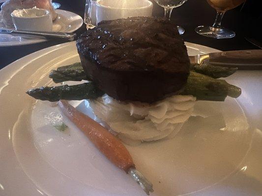 Filet mignon with mashed potatoes and asparagus.