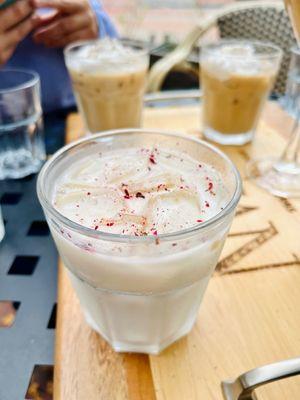 Iced latte with crushed rose petals