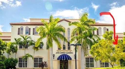 370 Camino Gardens Blvd, the arrow points to side entrance closest to the office. This front entrance is obscured by Banyan trees.