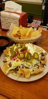 The nachos supreme with extra jalapenos and beef