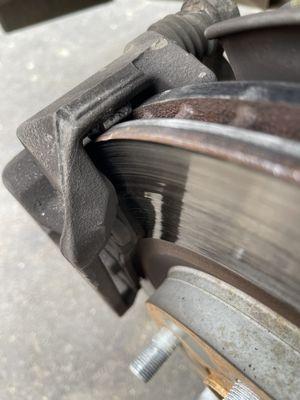 Wheel weight lodged between caliper and rotor