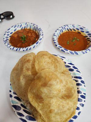 Thali meal - rice, poori, daal, and subji