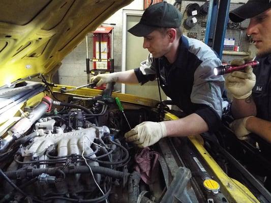 Victor performing tune up on a Nissan Xterra.