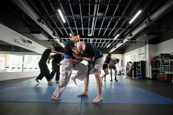 Students working on self-defense in our Krav Maga classes.