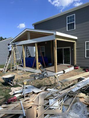 Midway composite screened porch build.