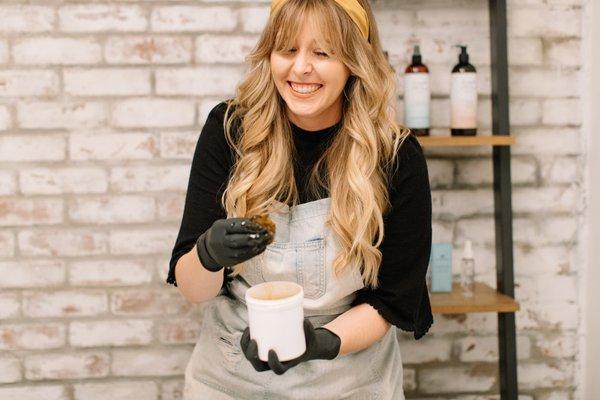 Can you tell by my scrunched nose, belly laugh captured in this photo that I love what I do?! Sugaring can be such a fun experience!