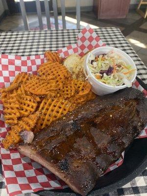 1/2 Slab Smoked Ribs With Sweet Potatoe Fries, Coleslaw, and a slice of toast.