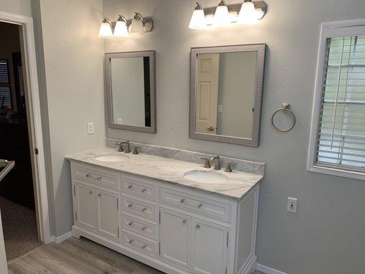 Full bathroom remodel. New vanity, counter tops, flooring, and a fresh paint job!