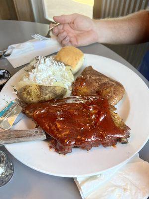 Rib and chicken special with potato, roll and salad.