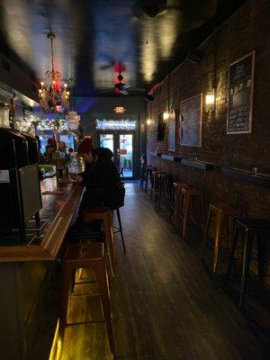 A bare-bones interior with their craft beers written on chalkboards