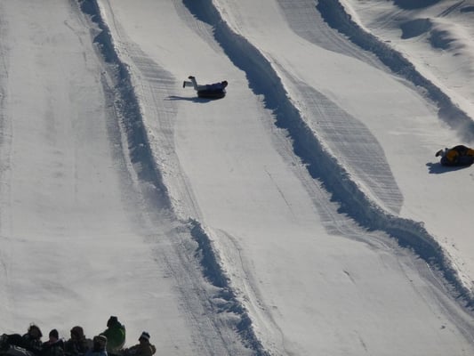 Snow tubing ~ ride the conveyor belt or handle tow up the hill & fly down the snow covered slopes solo or in groups of up to 25!