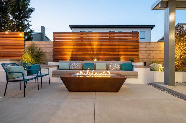 Custom built seating concrete bench with accent wood wall