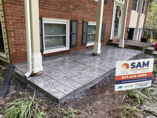 Concrete front porch with stamp and color