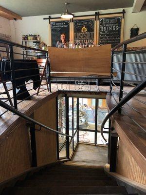 stairs down to distillery area from the tasting room