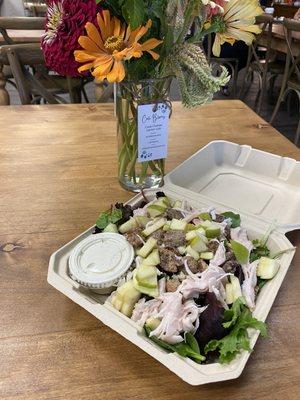 Apple nut salad with chicken and lovely local flowers.