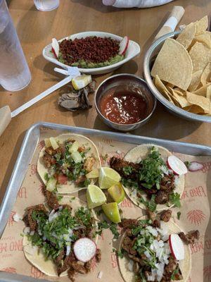 Mix of tacos.  Served almost cold and it looks like imitation bacon bits on the "fresh" guacamole.