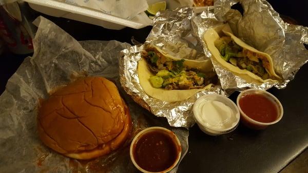 BBQ pork sandwich and 2 pork tacos. Sides of spicy Chipotle BBQ, sour cream, and salsa.