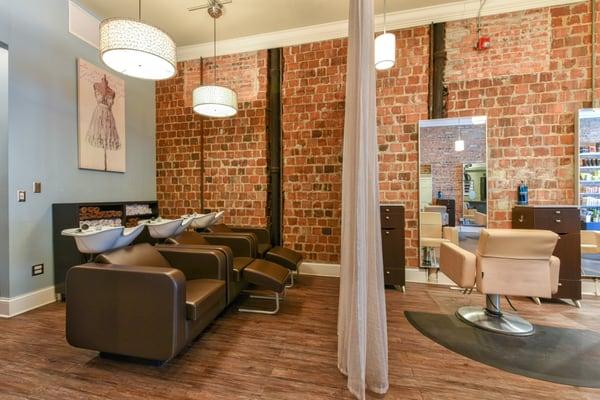 Shampoo area with exposed Brick walls