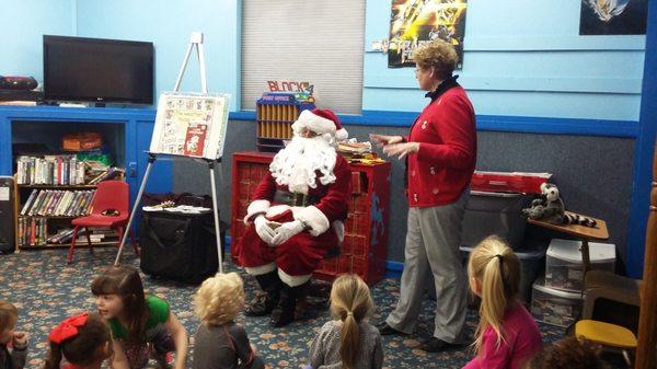 Santa visits Sunshine Playhouse with Mrs. Debbie Randal from the library.