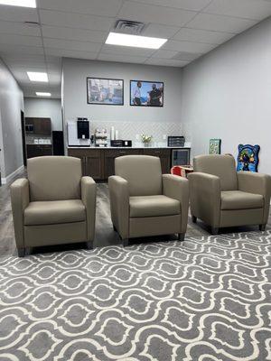 Nice and clean waiting room with water and tea