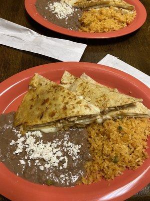 Chicken quesadilla with pinto beans and rice.