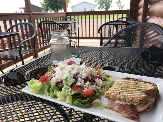 The half strawberry feta chicken salad and half turkey bacon cranberry panini.