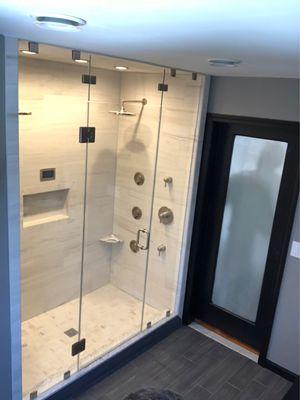 Steam showers need to be fully enclosed.  Panel above the door rotates to allow steam and fresh air to circulate!