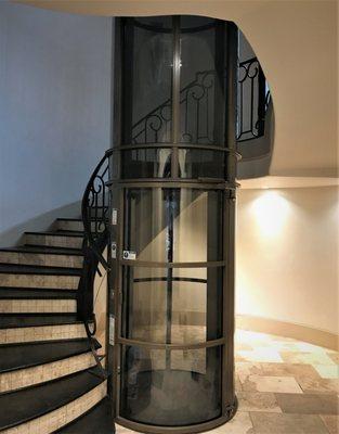 Vacuum elevator installed in  a circular stairwell in Austin, TX