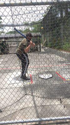 Practicing swings with slow pitched softballs