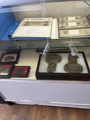 Confederate currency and Civil War buckles