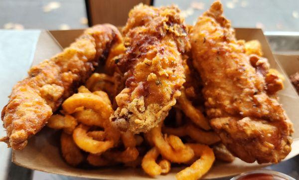 Generous serving of chicken strips and curly fries (10/20/23)