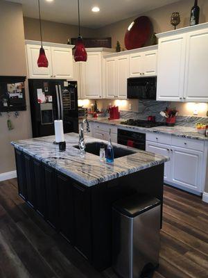 Granite Kitchen countertops with full back splash behind stove top only, 6" Splash, under mounted sink, an a Pencil edge.