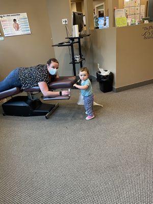 Toddler wanting her turn to be checked and adjusted so, she too may achieve optimal health before the "cold and flu season"!