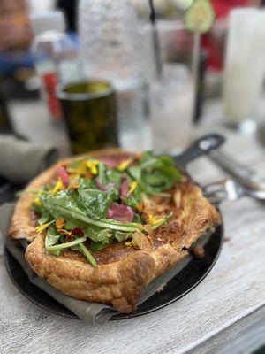 Quiche with mushrooms, purple cauliflower, gruyere. With greens and pickled onion on top.