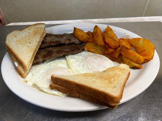 eggs over easy, homemade sausage, buffalo potato wedges & toast