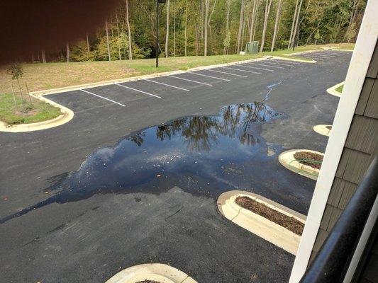 Sewage running out into parking lot