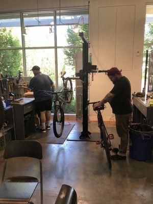 Brian and Ralphie swapping the platform pedals on my two bikes