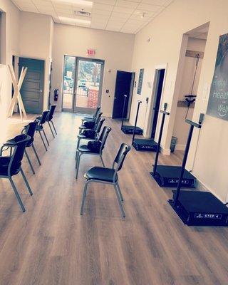 Pre-appointment area with balance cushions and instructions to loosen up before your adjustments!